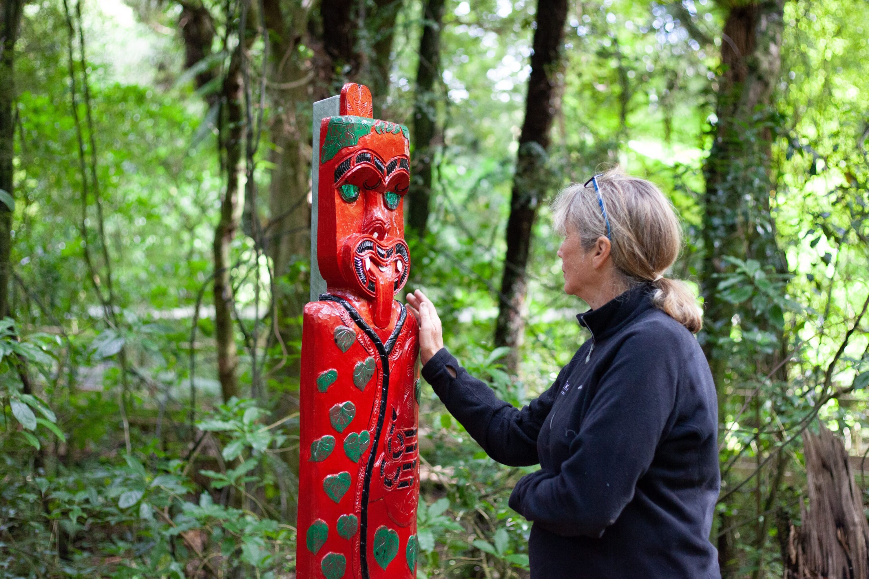 Carved pou in the Pūkaha reserve
